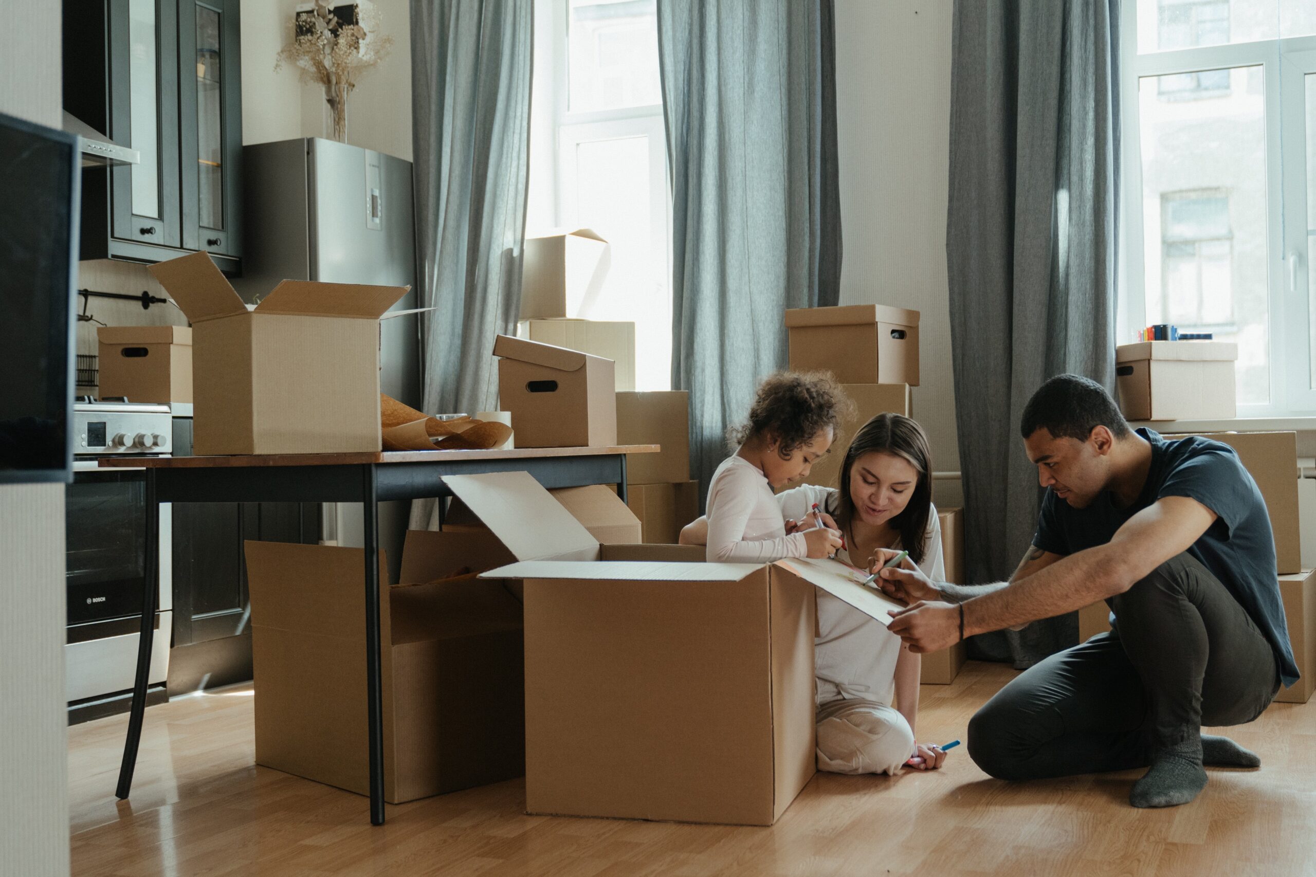 Photo by cottonbro studio: https://www.pexels.com/photo/family-unpacking-after-moving-4569340/